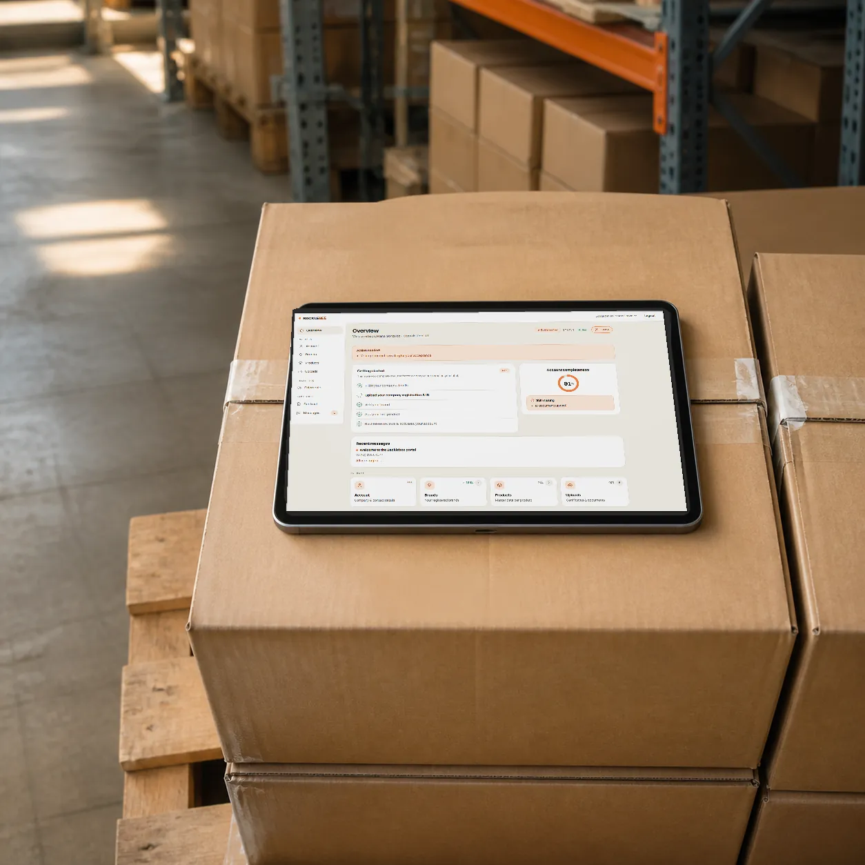 A tablet with the portal on a stack of cases in a warehouse